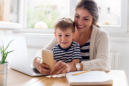 Mom Son On Phone Istock