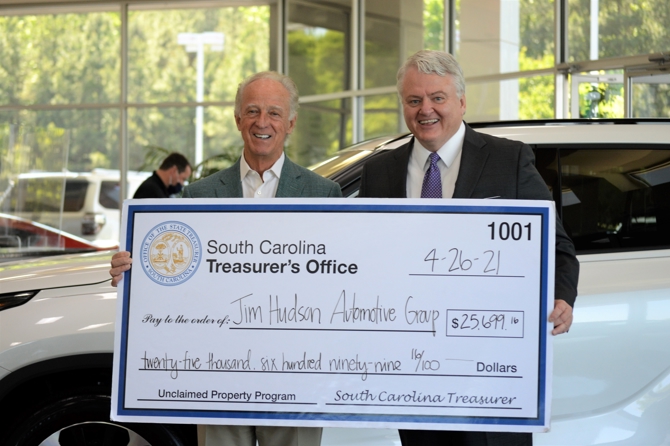 Jim Hudson accepts nearly $26K in unclaimed funds from State Treasurer Curtis Loftis.