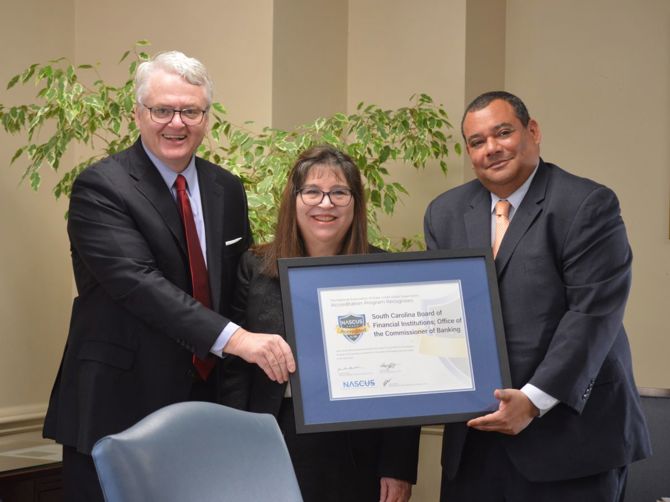 State Treasurer Curtis Loftis is pictured with SC Banking Commissioner Kathy Bickham and NASCUS President and CEO Brian Knight during formal recognition of the state’s recent accreditation at Wednesday’s Board of Financial Institutions monthly meeting in Columbia.